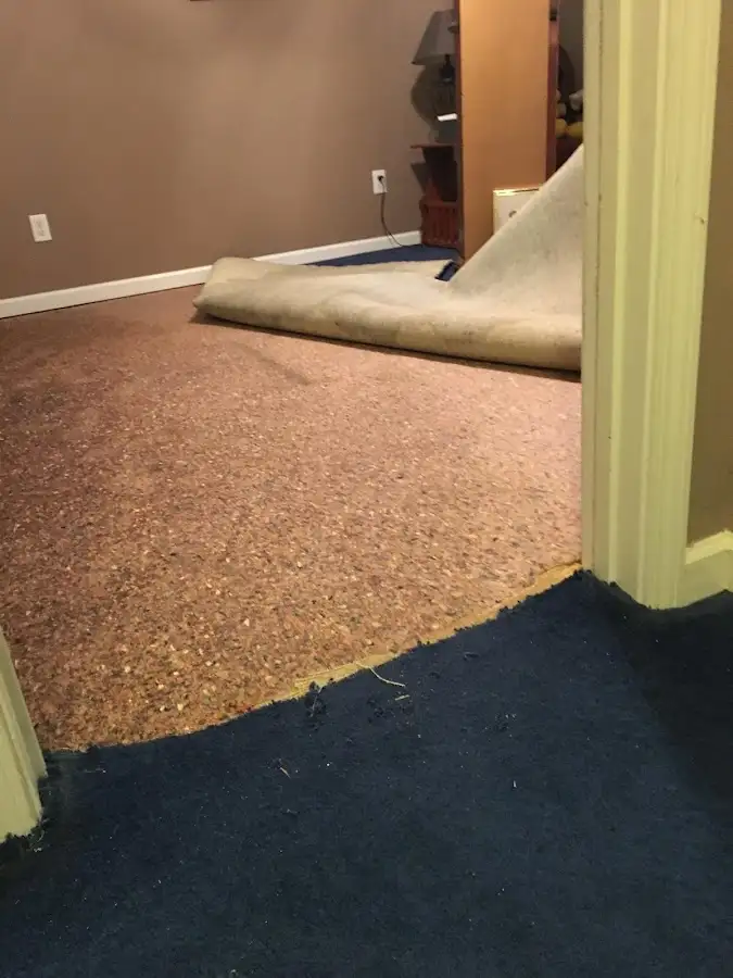 Carpet pad removal revealing water damage during Drying & Dehumidification in Alum Rock